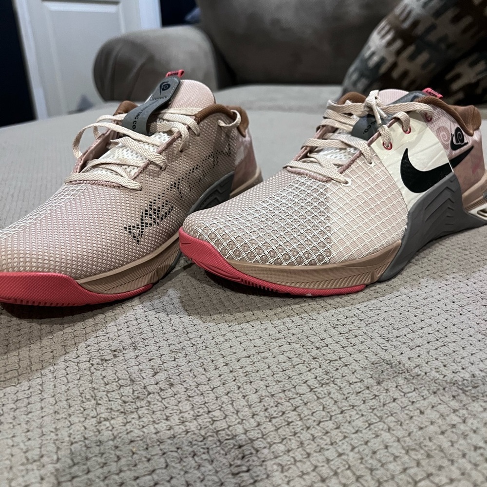 Nike Pink and Cream Athletic Shoes with Breathable Design